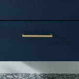 Lifestyle image of Vado Cameo Satin Brass Furniture Handle Bar Close up on Blue Cameo Unit - CAM-HANB-SBR